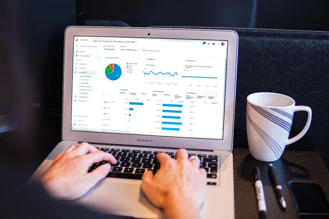 Google Analytics dashboard on laptop showing digital marketing performance metrics and reporting