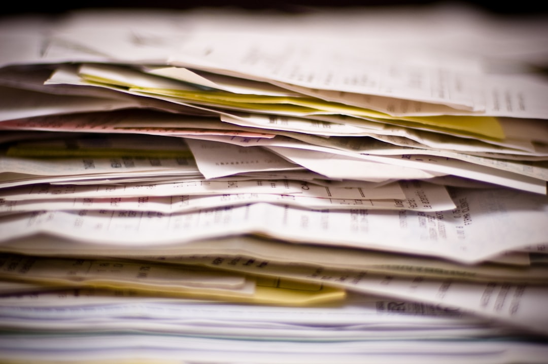 Overwhelming pile of invoices, receipts and financial documents representing hidden costs and surprise fees
